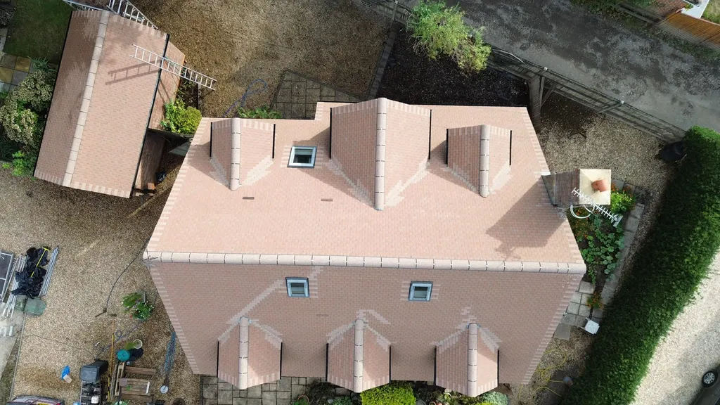 Tiled roof with dormer windows after work