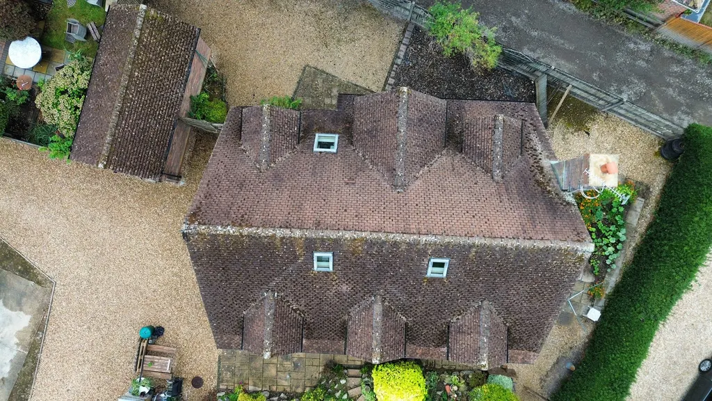 Tiled roof with dormer windows before work