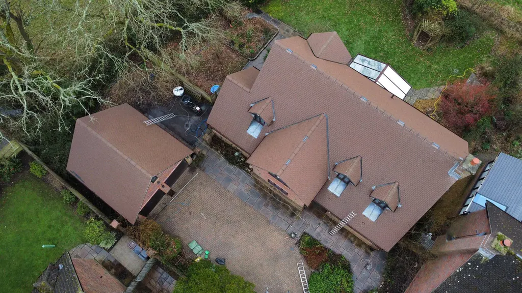 Tiled roof with a conservatory after work