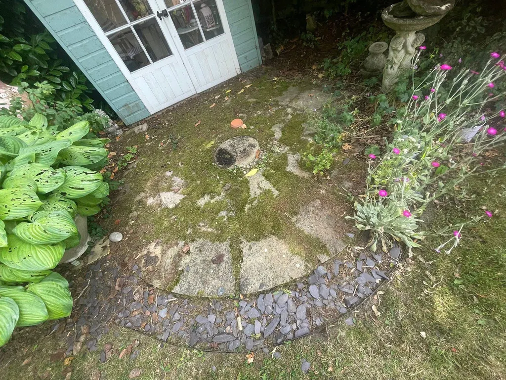 Circular stone patio before work