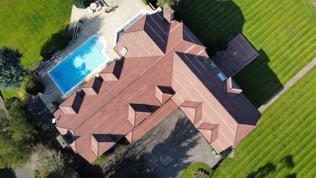 Aerial view of a tiled roof after cleaning